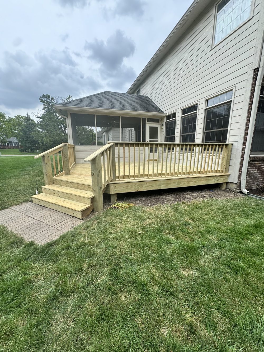 New wood deck and steps at the rear of a home